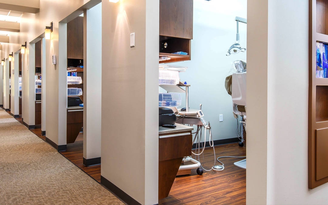view from a hallway looking into dental operatories